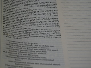 A close-up view of a printed page with a column of text on the left and a lined section for notes on the right. The text is clearly readable and appears to be from a book, with paragraphs and indented dialogue or quotes.