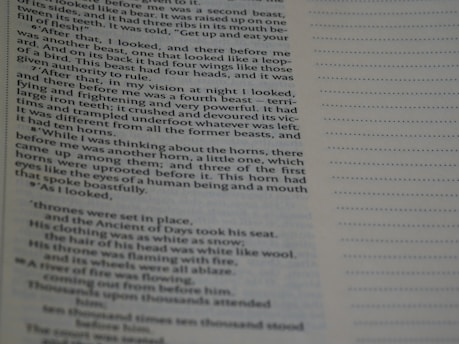 A close-up view of a printed page with a column of text on the left and a lined section for notes on the right. The text is clearly readable and appears to be from a book, with paragraphs and indented dialogue or quotes.