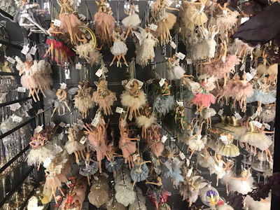 An array of sparkling classical dance ornaments laid out on a velvet cloth.