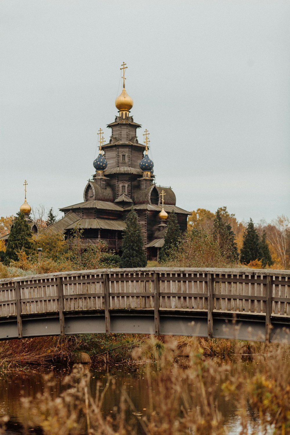 a bridge with a building in the background