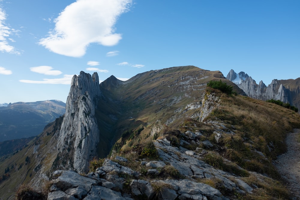 a view of a mountain with a trail going up the side of it