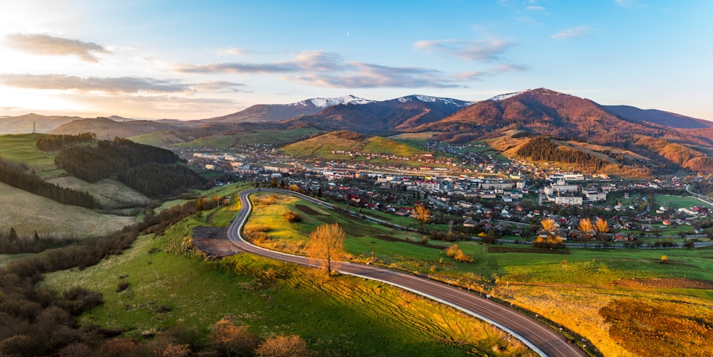 a scenic view of a town in the mountains