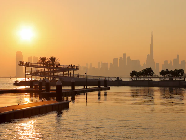 City skyline with tall towers at sunset
