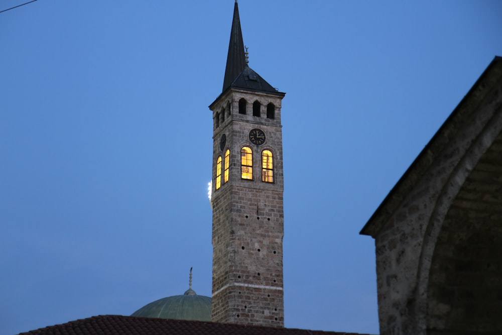 a tall tower with a clock at the top of it