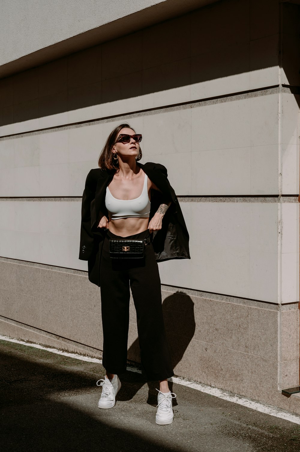 a woman standing in front of a building