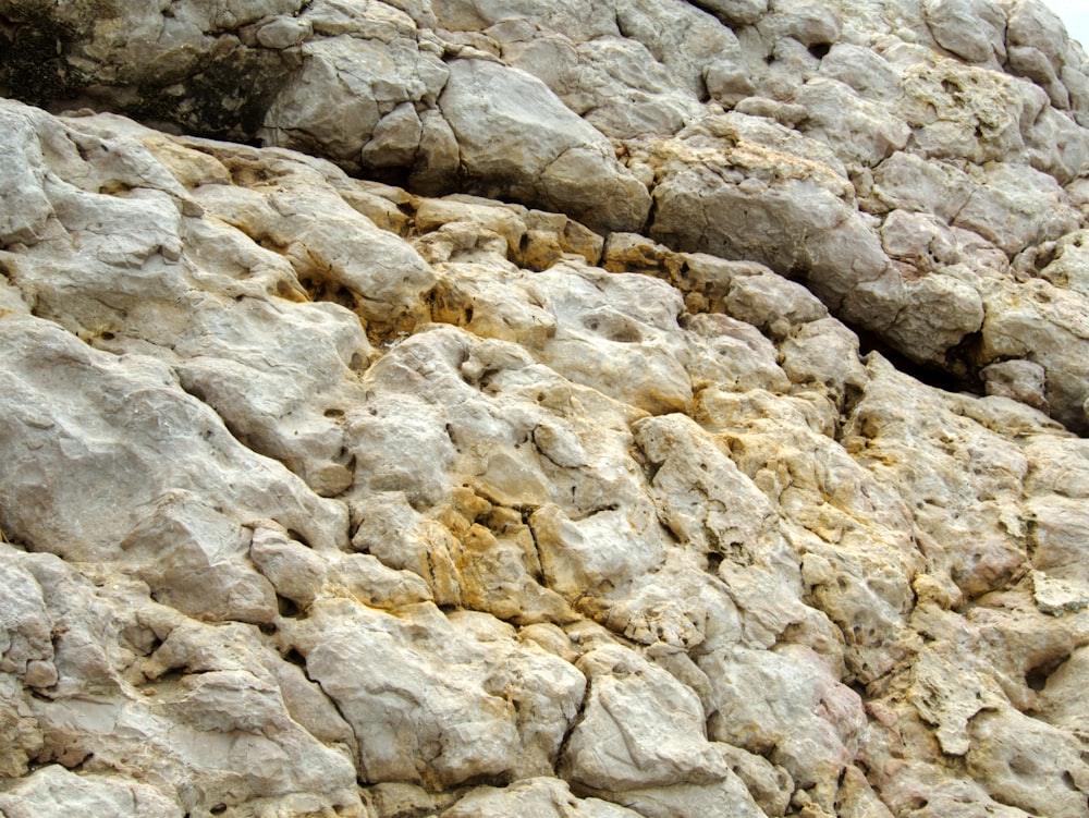 a close up of rocks with a sky in the background