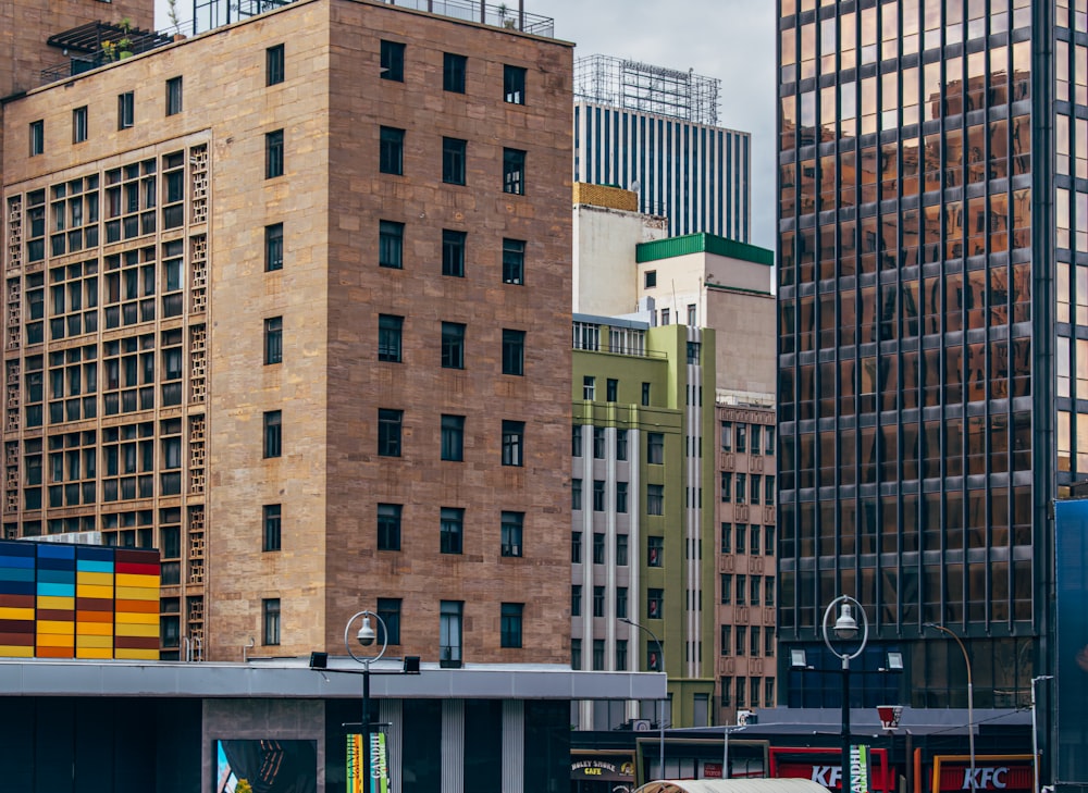 a group of tall buildings next to each other