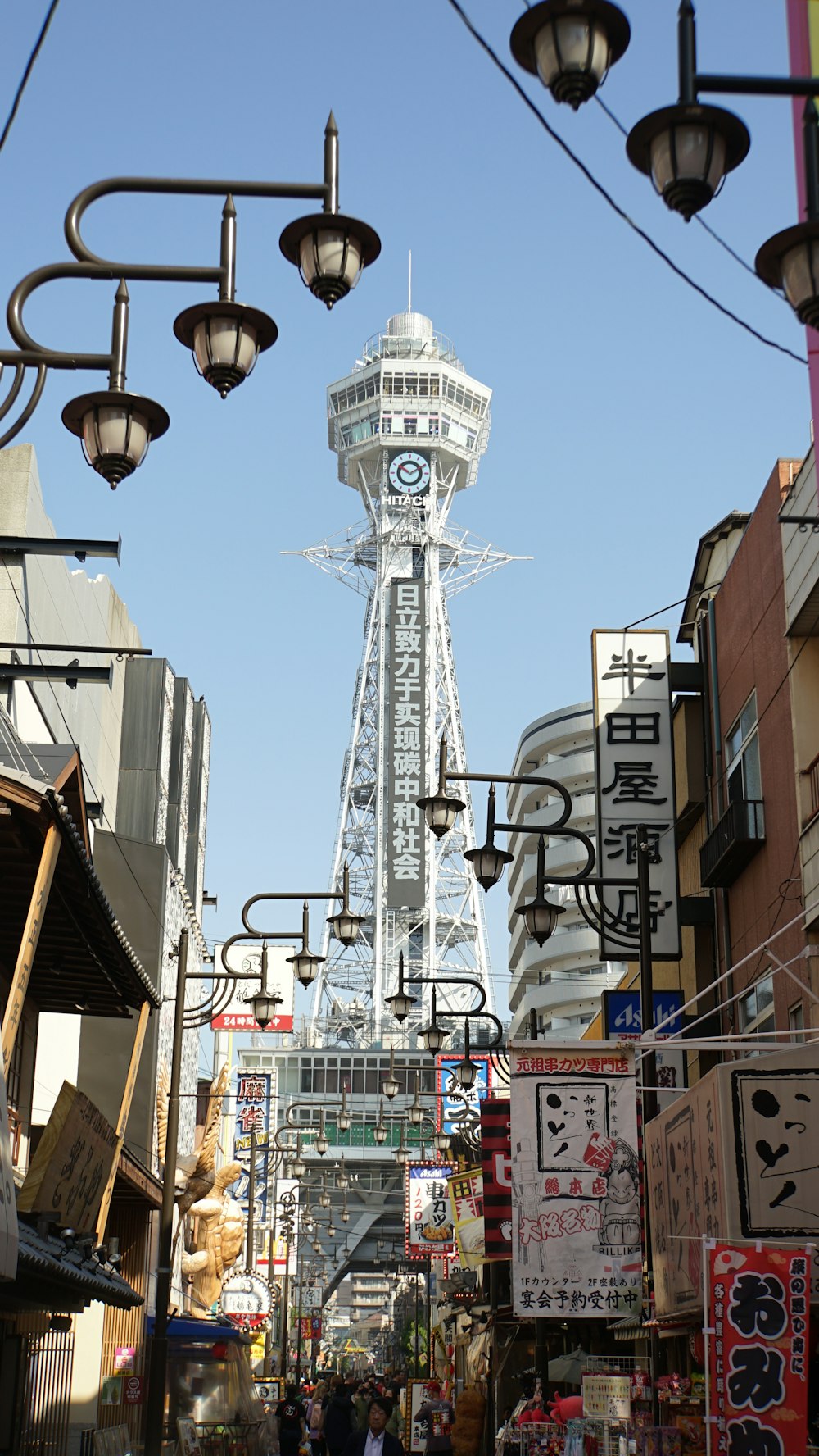 a tall tower towering over a city filled with tall buildings