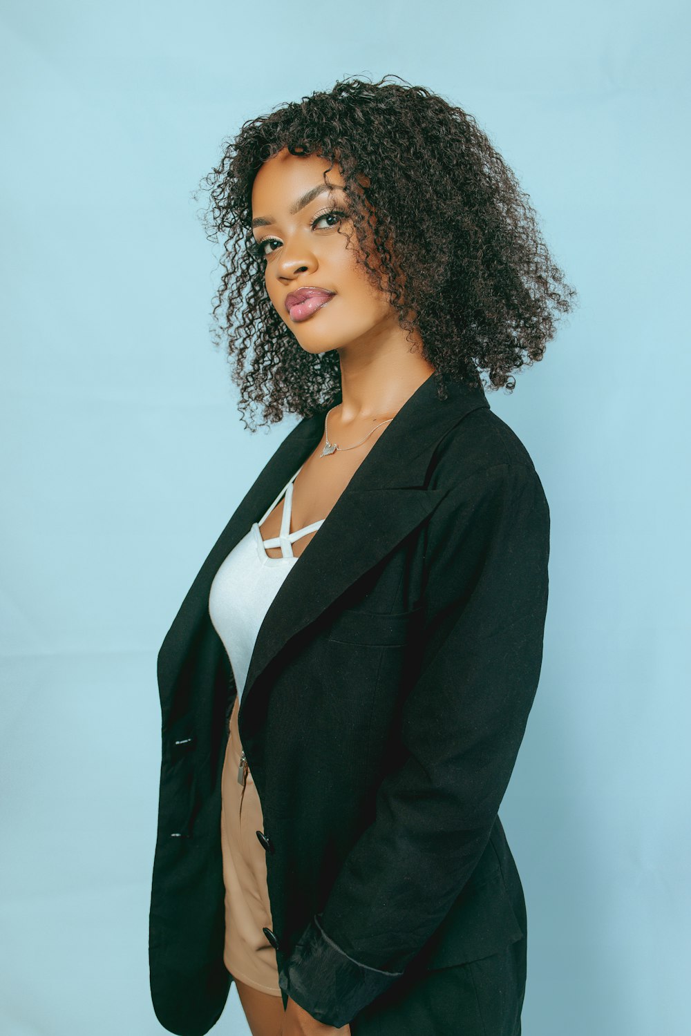 a woman posing for a picture in a black jacket