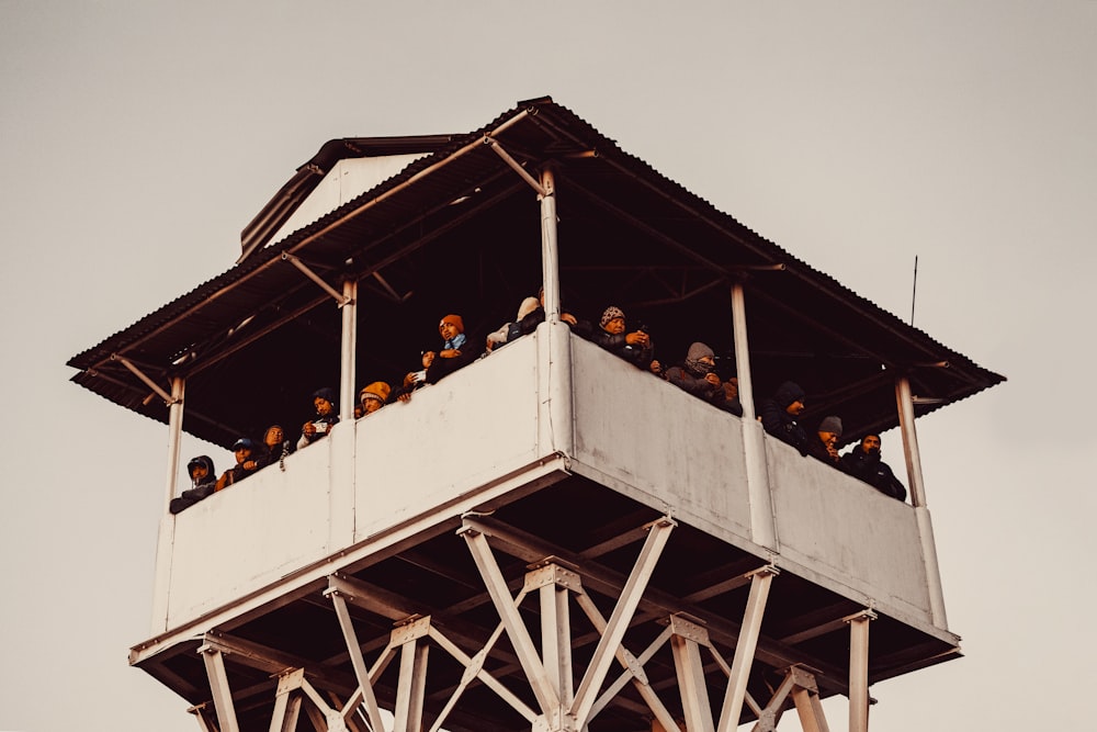 a tall tower with a bunch of people on top of it