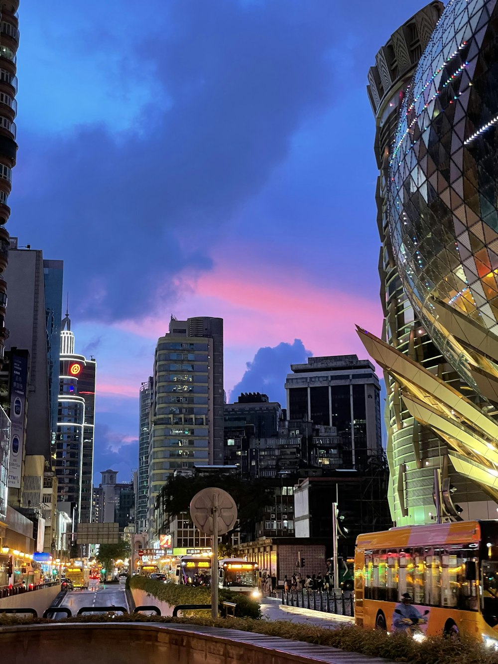 a city street filled with lots of tall buildings