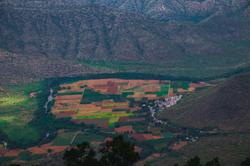 an aerial view of a valley with a river running through it