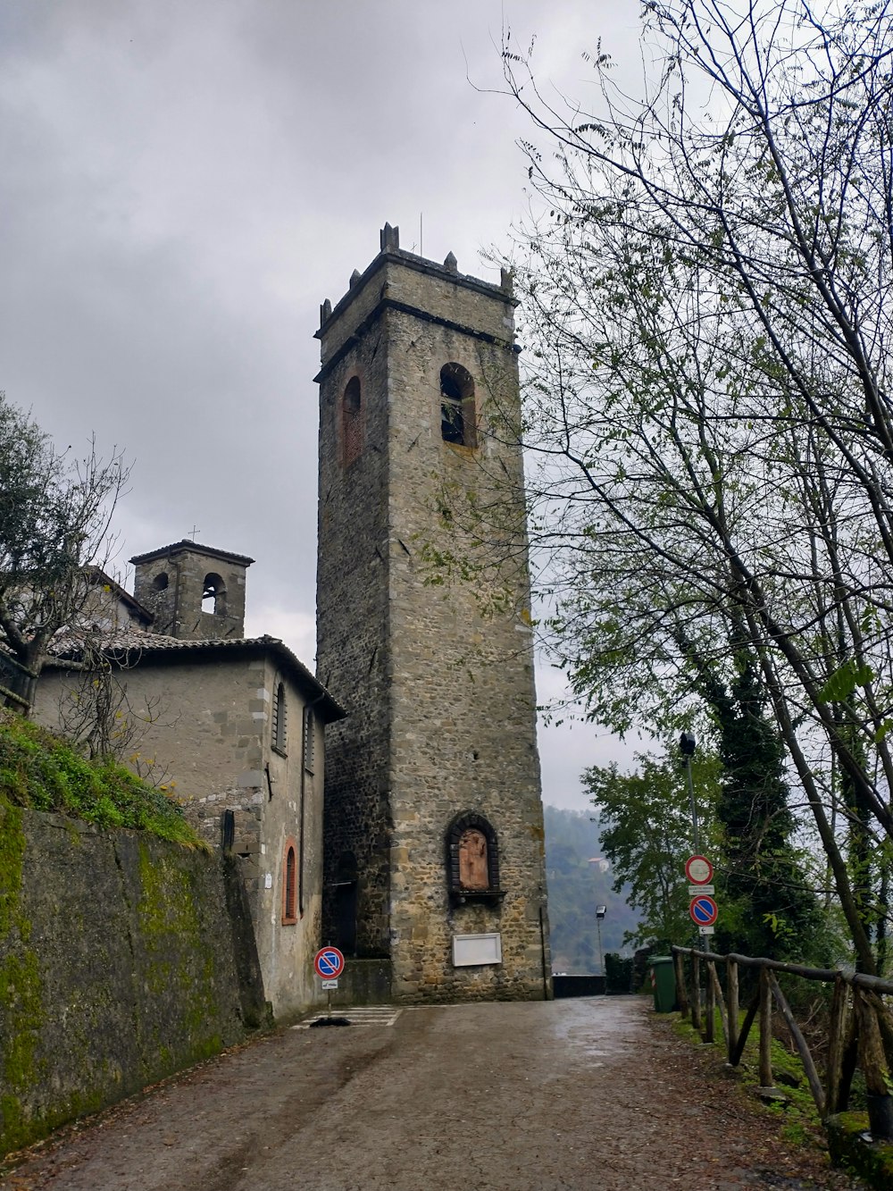 a tall tower sitting on the side of a road