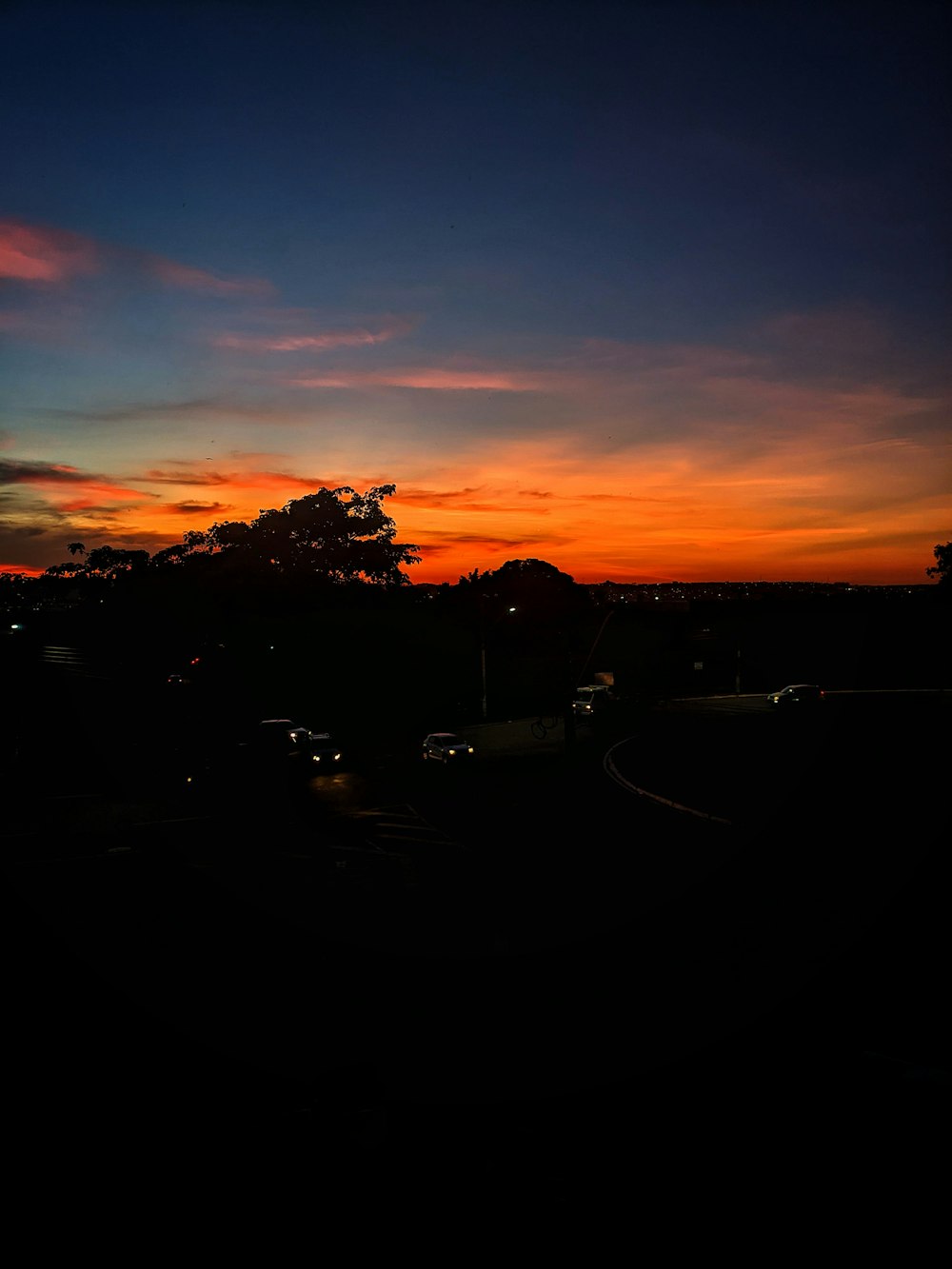 a view of a sunset from a hill top