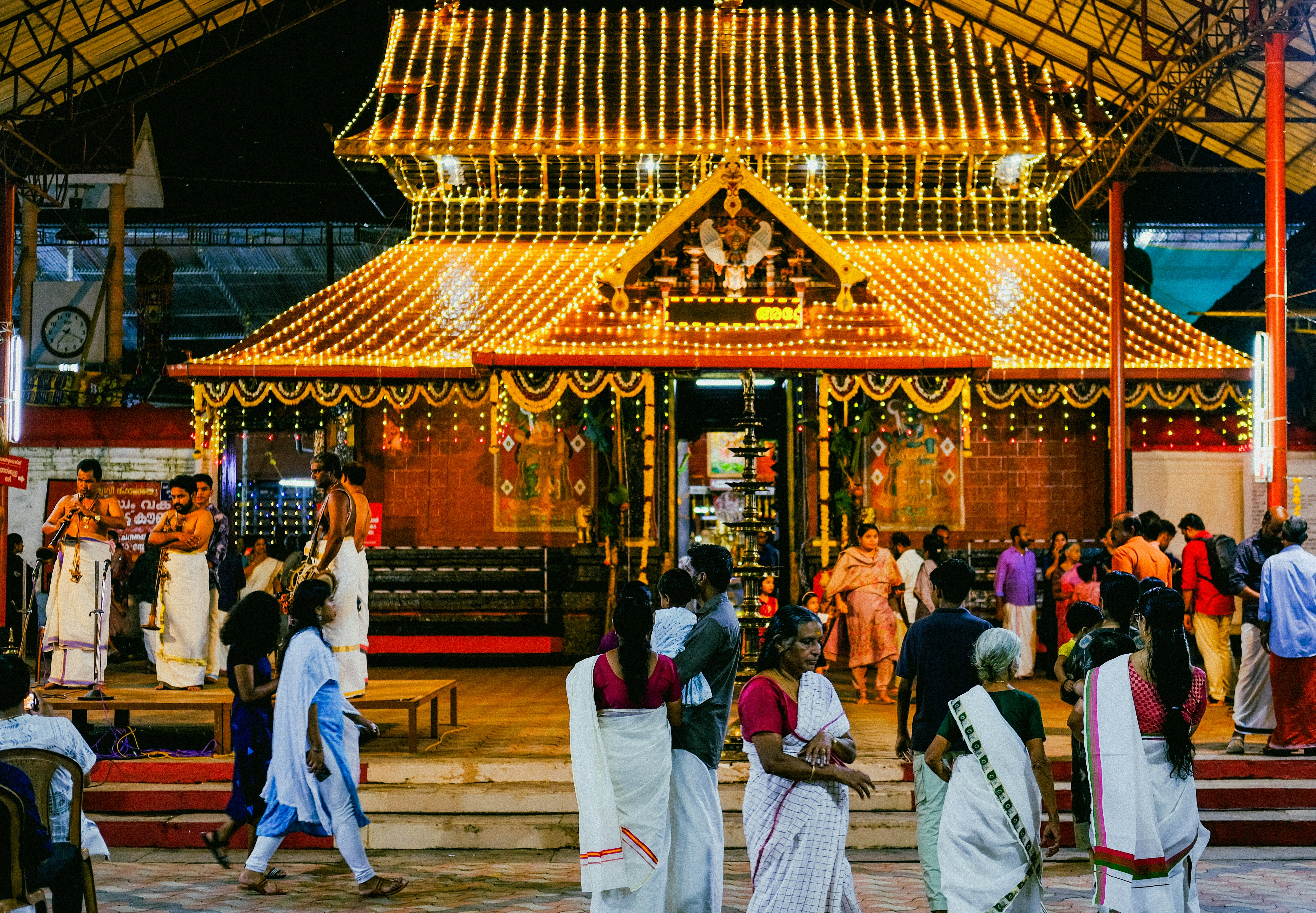a group of people standing in front of a building