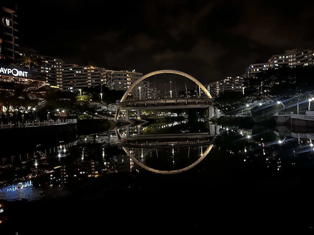 a bridge over a body of water at night