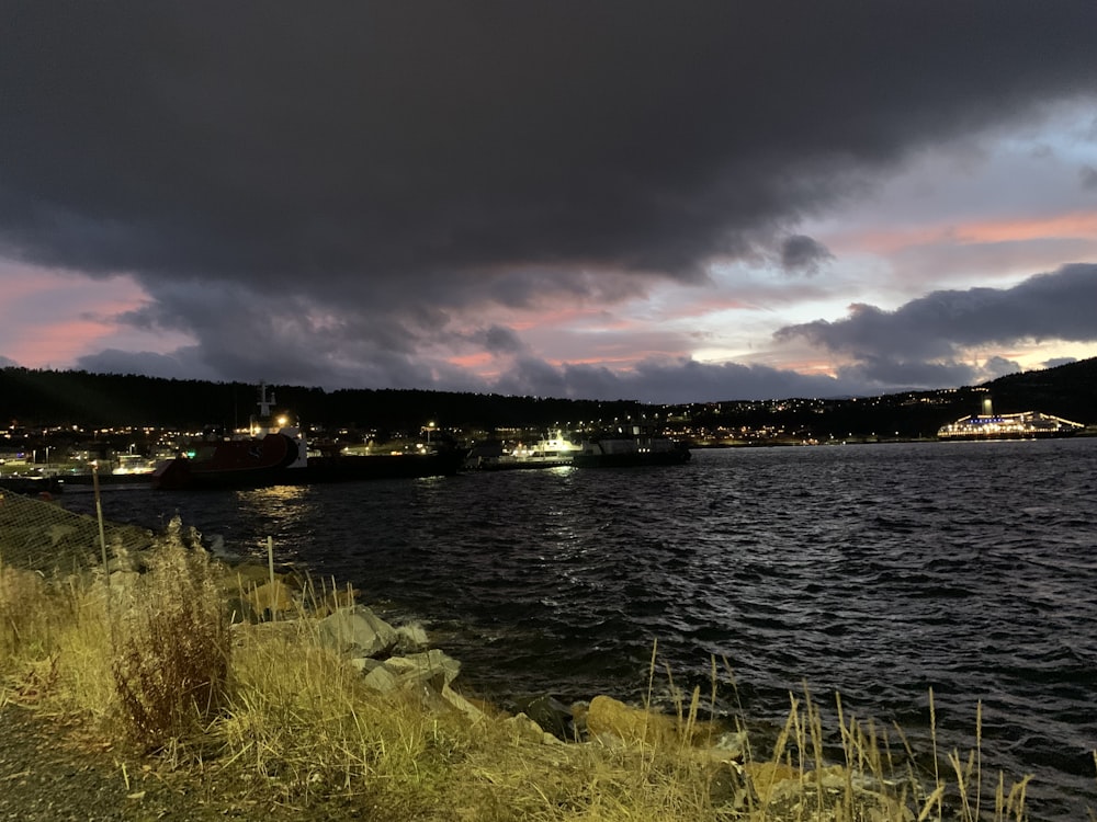 a large body of water under a cloudy sky