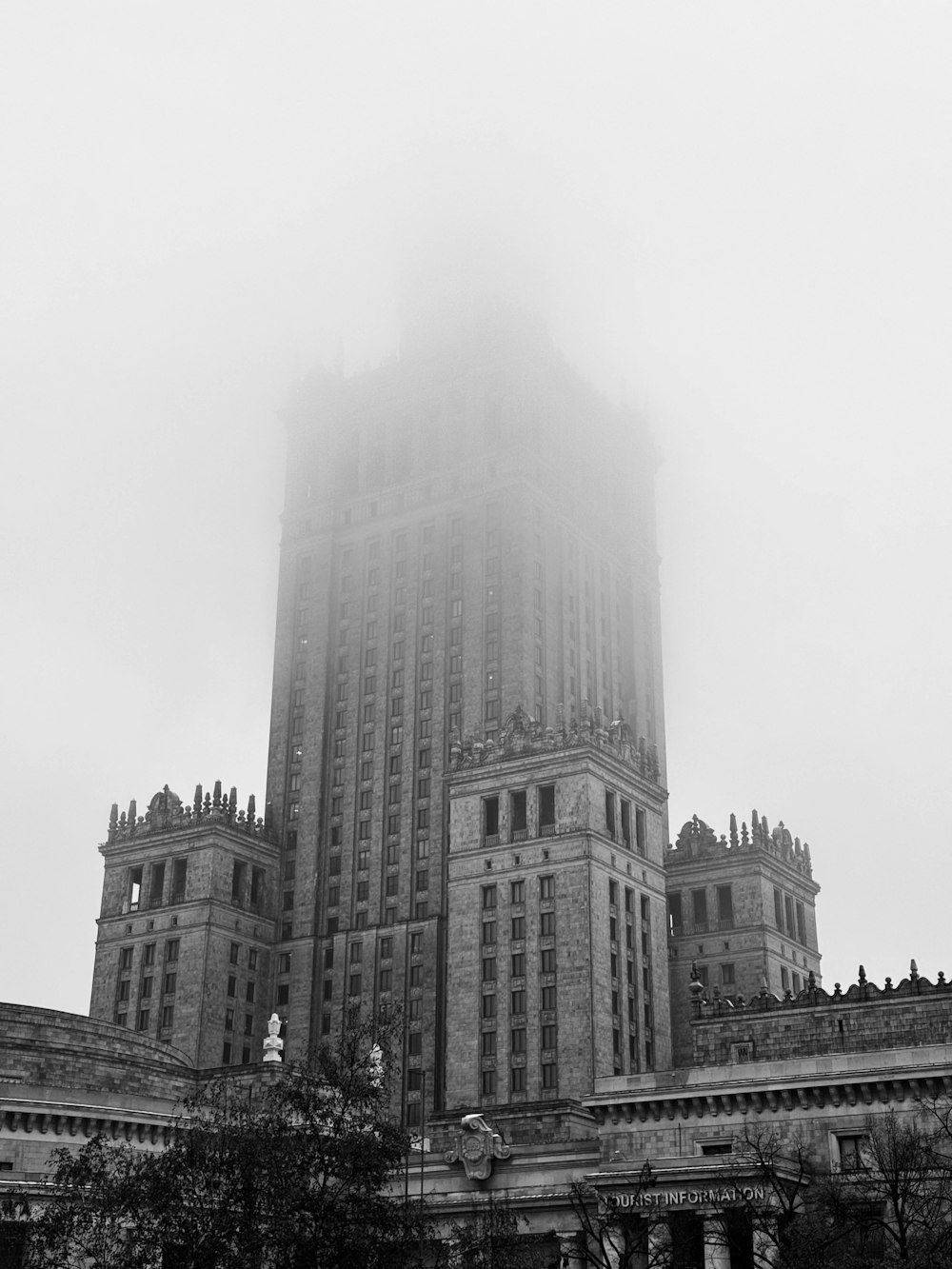 a very tall building with a clock on it's side