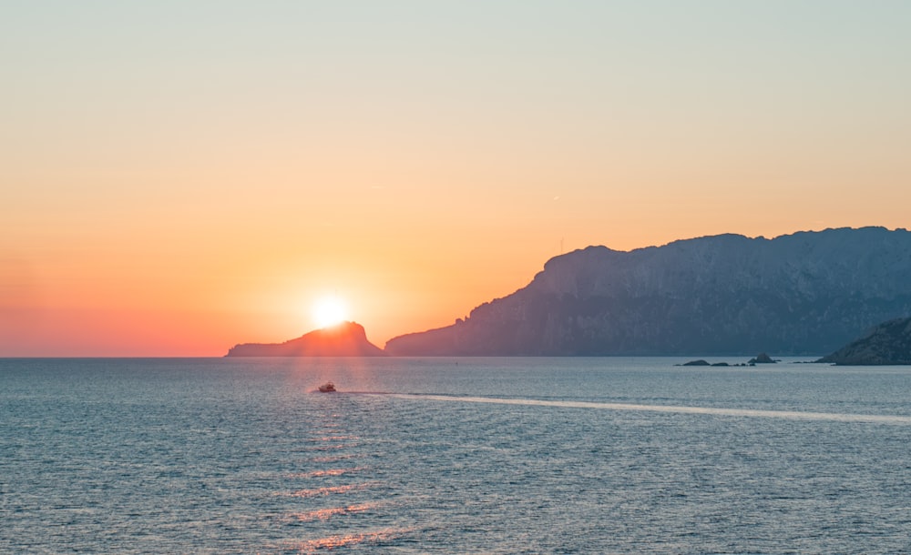 a boat traveling across a large body of water