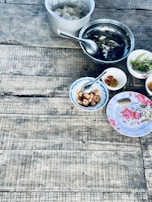 Various dishes arranged on a wooden table, ready for delivery.