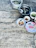 Close-up of a rustic wooden table with bowls of different rice varieties, including 386 parboiled rice.