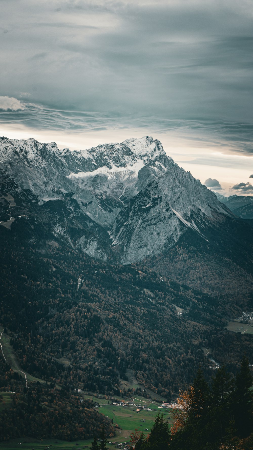 a view of a mountain range with a cloudy sky