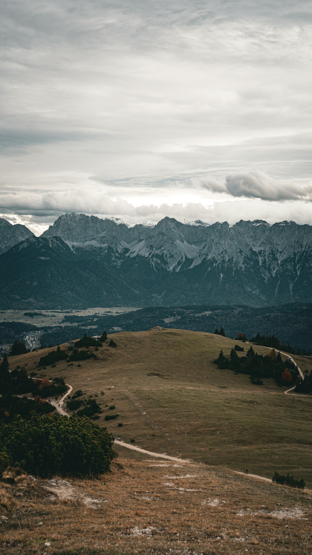 a view of the mountains from a hill top