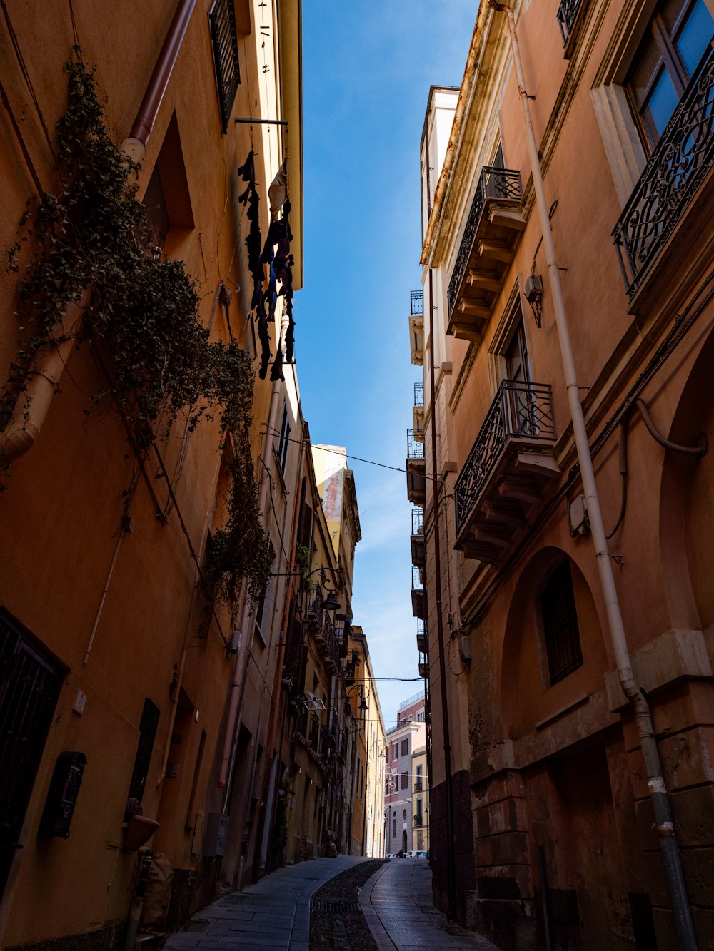 a narrow city street with buildings on both sides