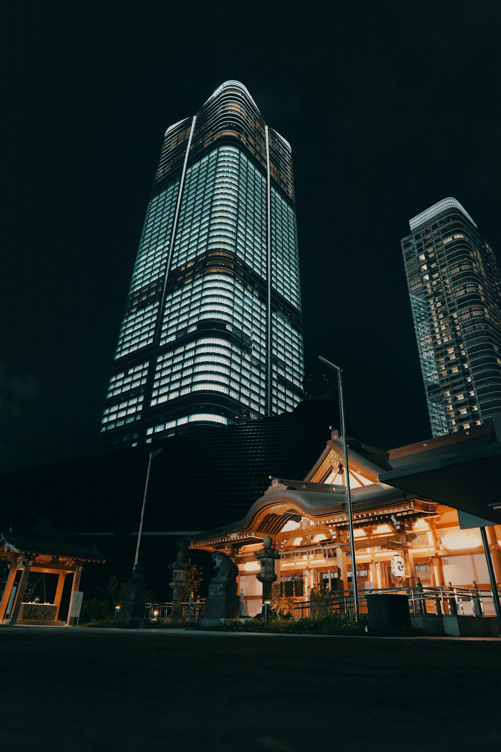 a tall building sitting next to other tall buildings