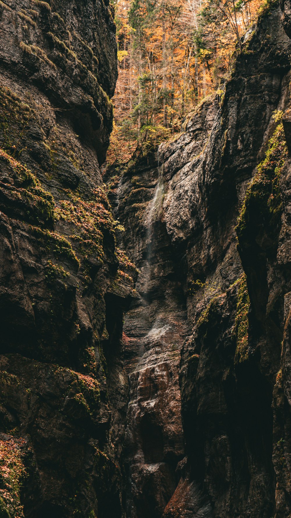 a waterfall in the middle of a rocky area