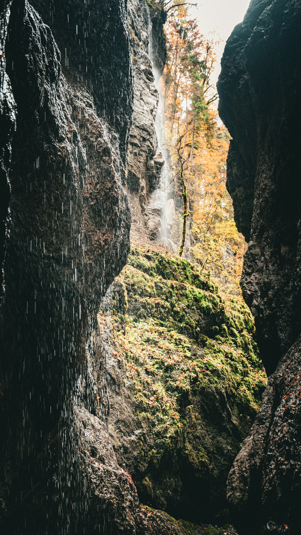 a waterfall in the middle of a rocky area