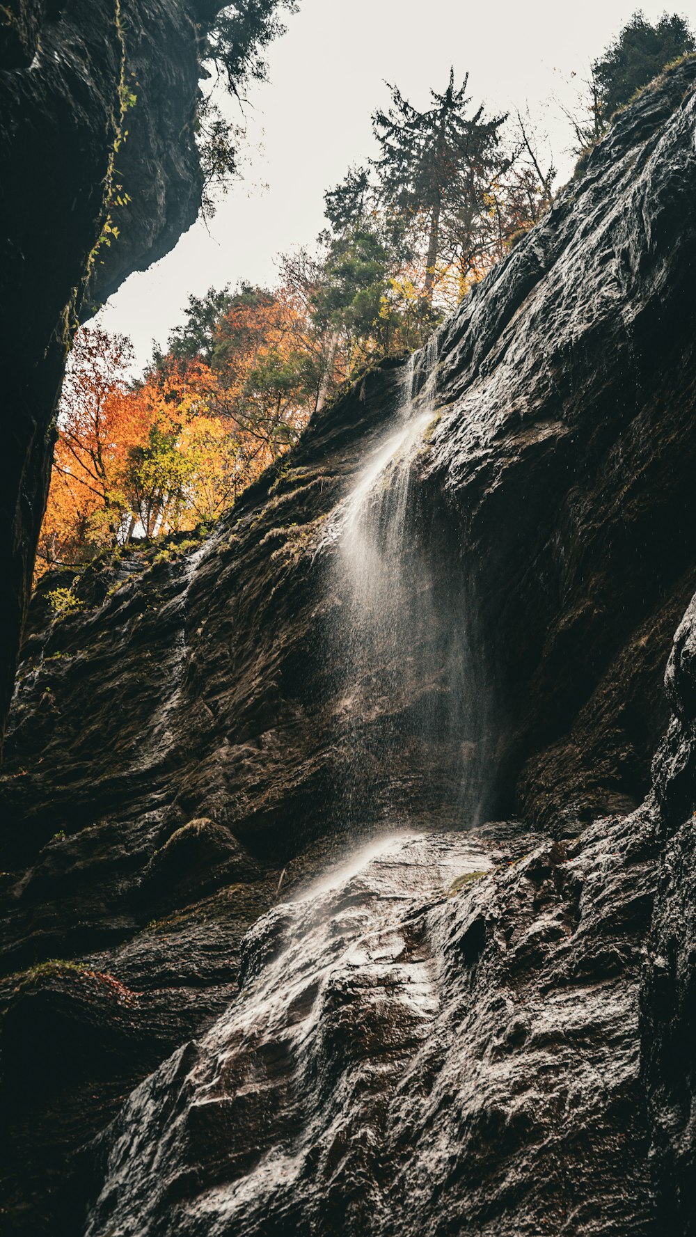 a small waterfall cascading down the side of a cliff
