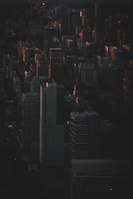 A cinematic frame of a cityscape at twilight with rich shadows and highlights, emphasizing composition.