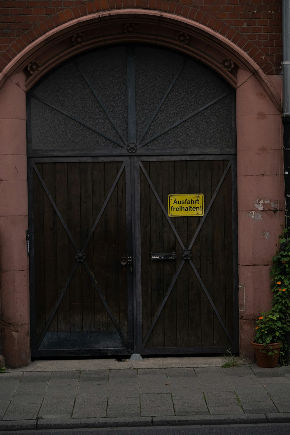 a brown door with a yellow sign on it
