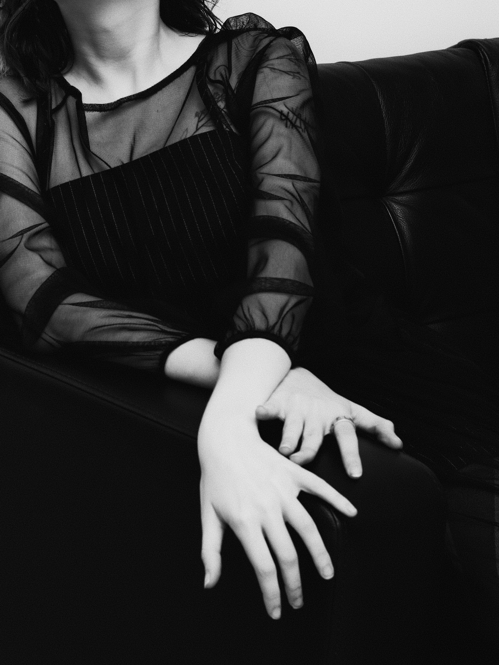 a black and white photo of a woman in a dress