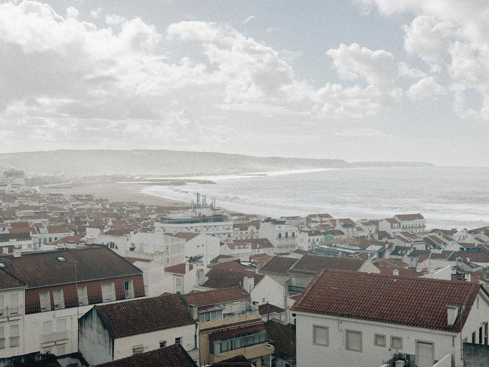 a view of a city with a body of water in the background