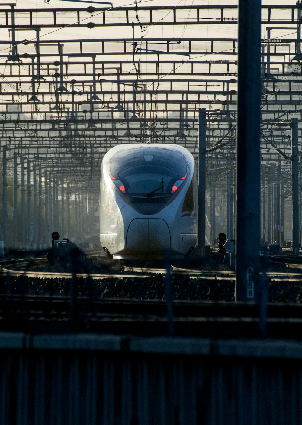 a white train traveling through a train station