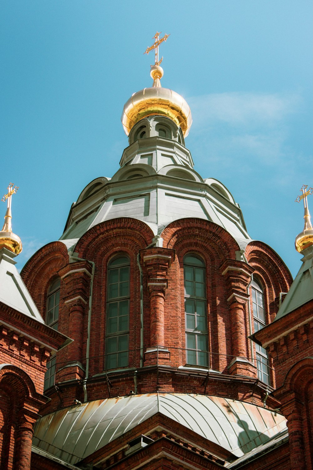 a large building with a cross on top of it