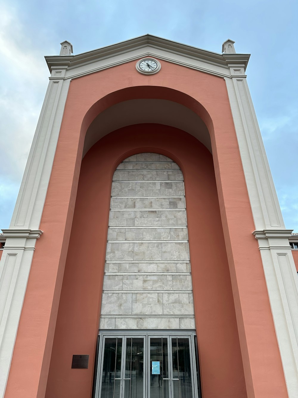 a tall building with a clock on the top of it