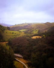Freshly paved road winding through a scenic Scottish landscape