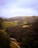 A scenic view of the Scottish Highlands with lush green hills.