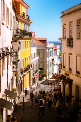 A vibrant street scene in Bahia with colorful buildings and local people enjoying a sunny day.