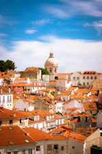 A scenic view of a peaceful Andalusian neighborhood with whitewashed houses and greenery.