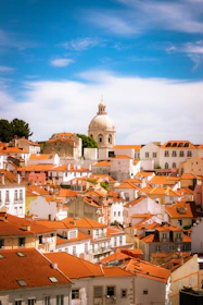 A scenic view of a peaceful Andalusian neighborhood with whitewashed houses and greenery.