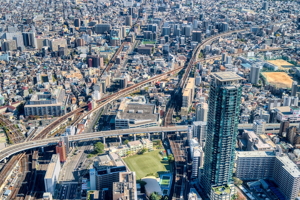 an aerial view of a city with lots of tall buildings