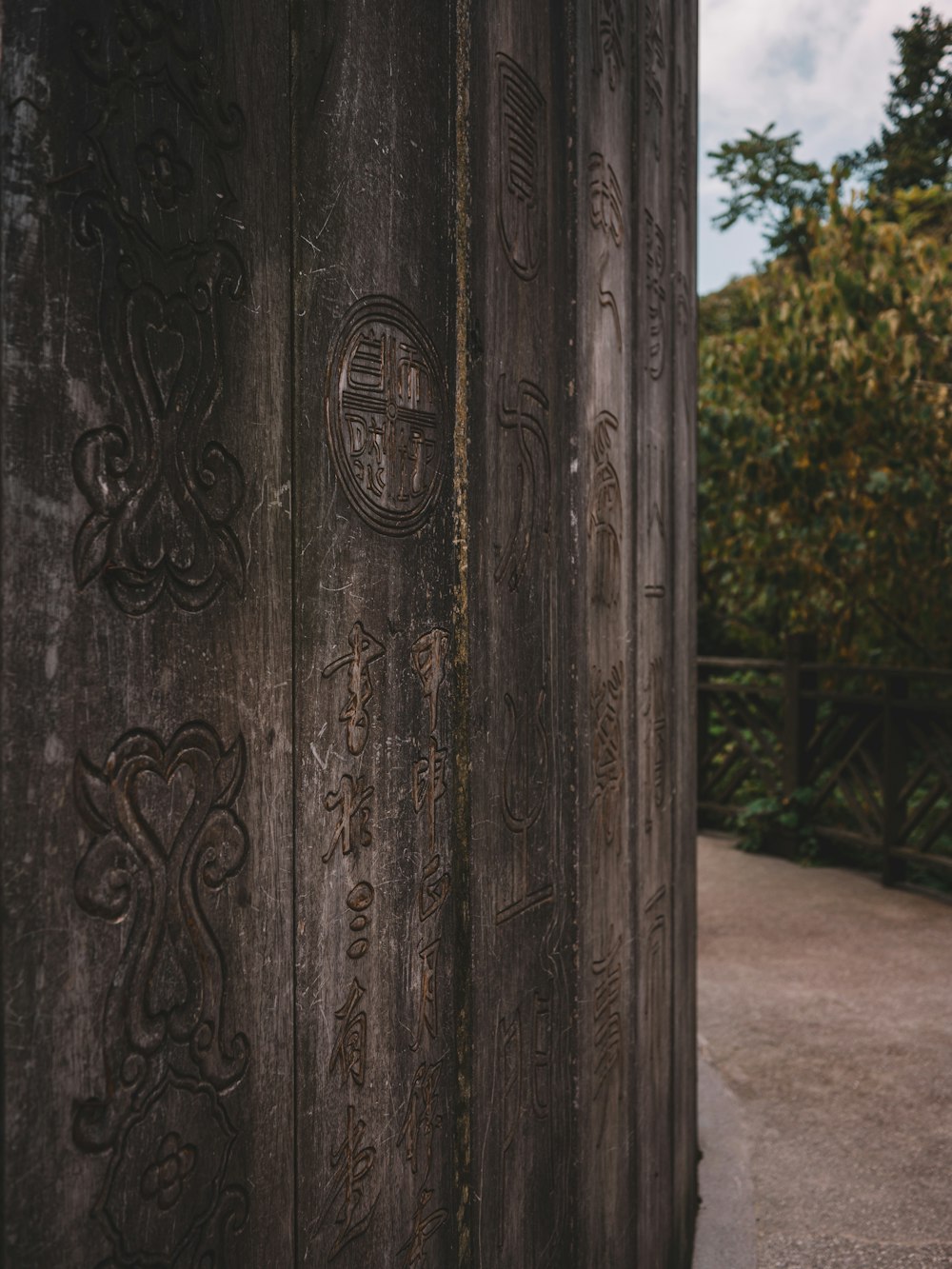 a close up of a wooden structure with writing on it