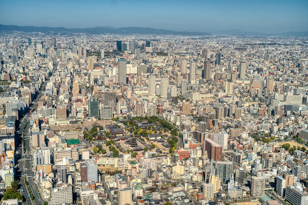 an aerial view of a city with tall buildings