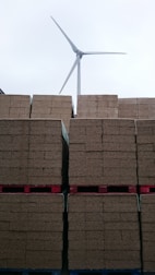 Stacks of packaged materials prepared for shipment to energy manufacturers.