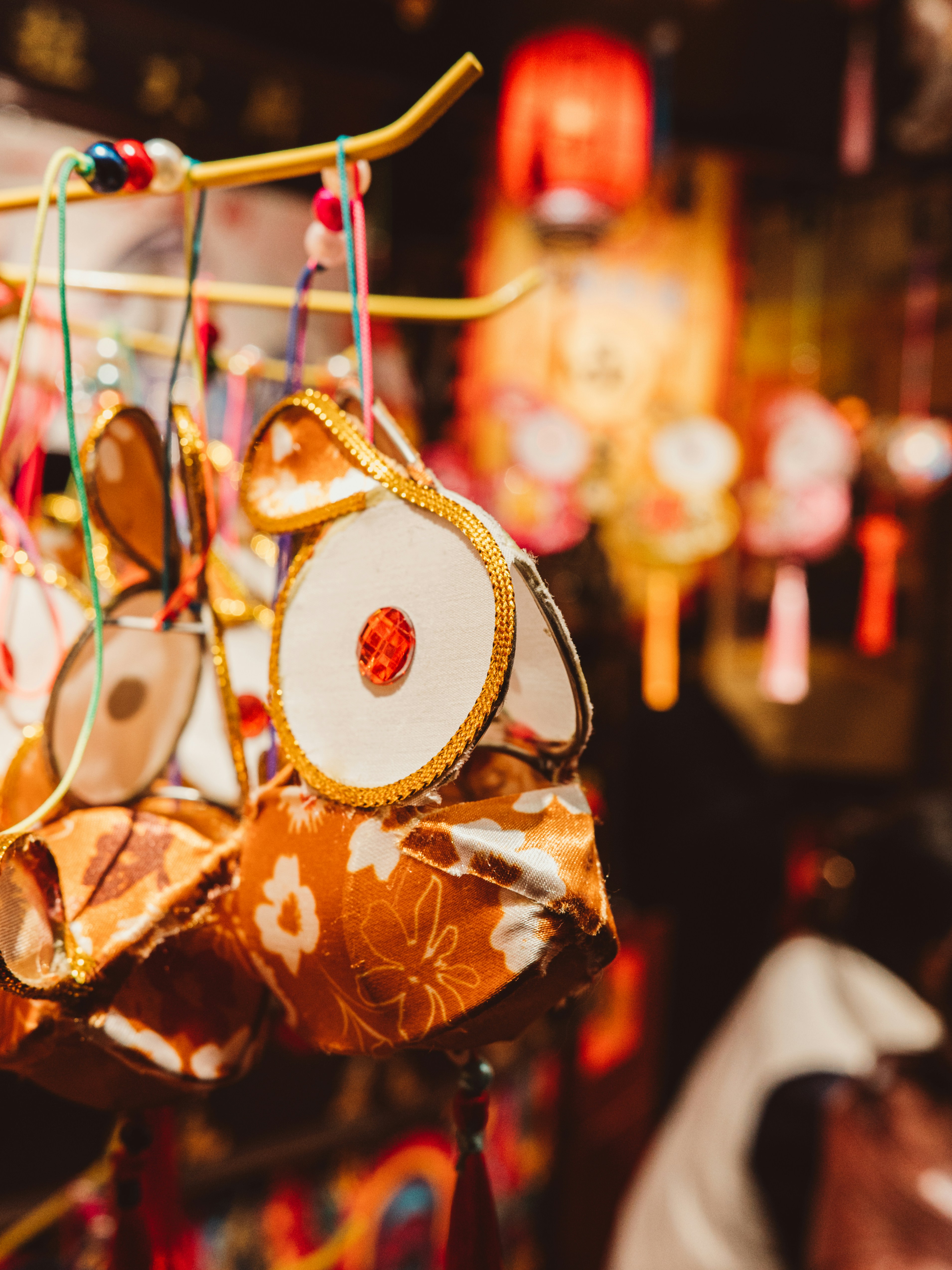 a close up of a chinese lantern hanging from a string