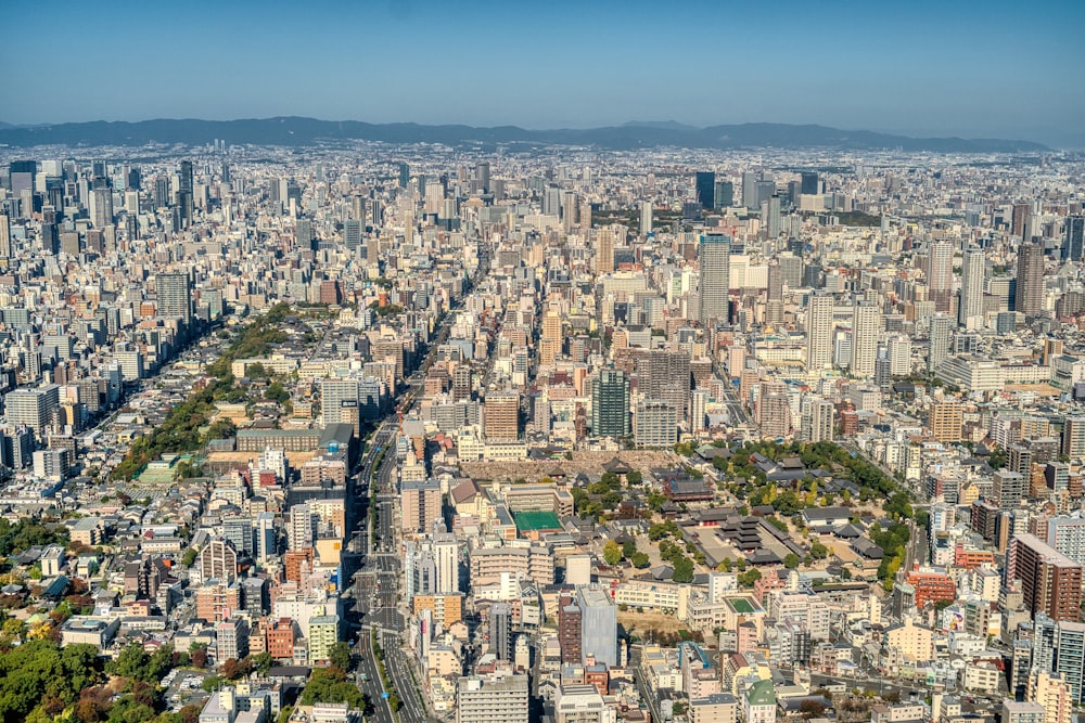 an aerial view of a city with lots of tall buildings